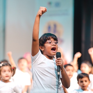 Child speaking at an event