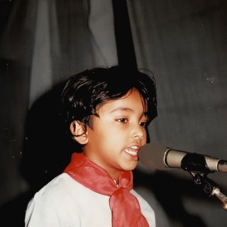 Child singing at a microphone